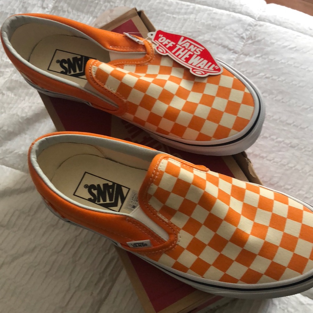 Orange and white Vans